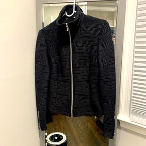 Black form fitting zip up jacket